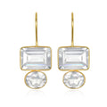 Gold earrings with clear rectangular gemstones on a white background