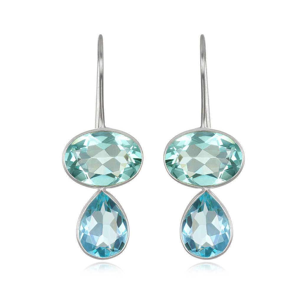 Pair of earrings with blue gemstones on a white background